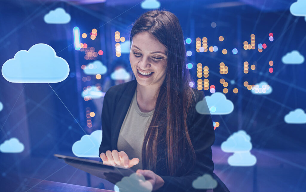 A woman smiling and using a tablet, surrounded by digital cloud icons, representing cloud computing and data management.